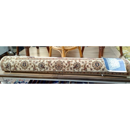 245 - A large beige patterned/ Persian rug. Length 2.28cm x 1.60cm, COLLECT ONLY.