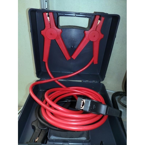 291 - A boxed set of jump leads, work light and a ring battery charger.  COLLECT ONLY.