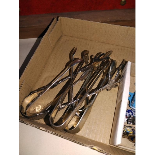 1161 - A quantity of tourist collectable tea spoons and sugar tongs.