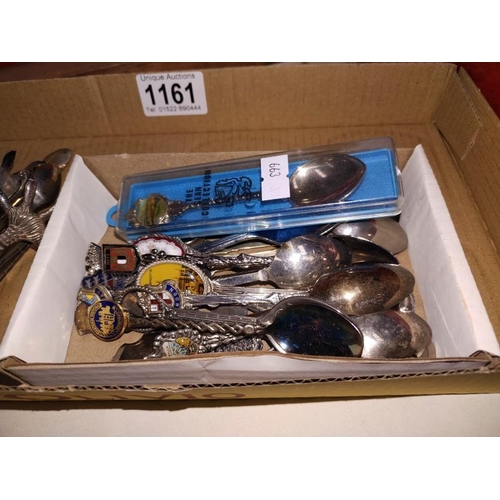 1161 - A quantity of tourist collectable tea spoons and sugar tongs.