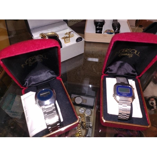 1172 - A quantity of boxed watches including Ingersoll digital watches.