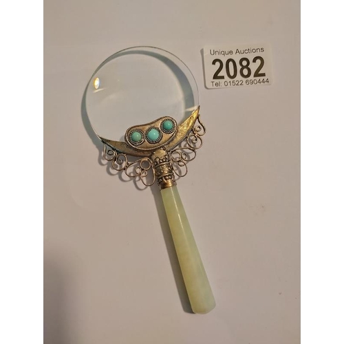 2082 - An Oriental Jade handle magnifying glass. Length 14.5cm.