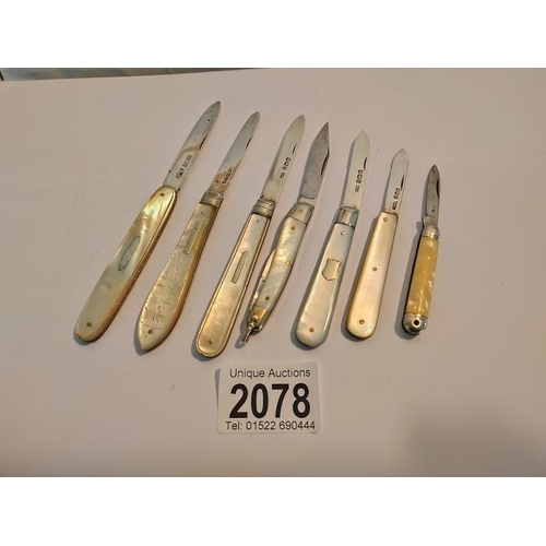 2078 - A collection of five silver and mother of pearl fruit/penknives and two others.