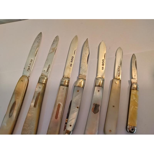 2078 - A collection of five silver and mother of pearl fruit/penknives and two others.