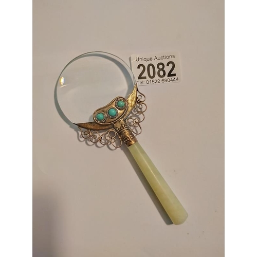 2082 - An Oriental Jade handle magnifying glass. Length 14.5cm.