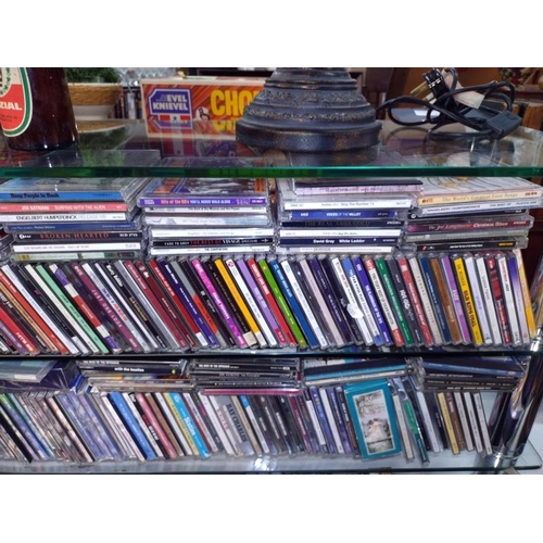 1196 - A large quantity of CD's and a quantity of cassette tapes including Madonna and Eric Clapton etc