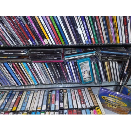 1196 - A large quantity of CD's and a quantity of cassette tapes including Madonna and Eric Clapton etc