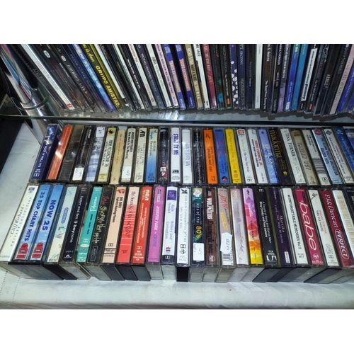 1196 - A large quantity of CD's and a quantity of cassette tapes including Madonna and Eric Clapton etc