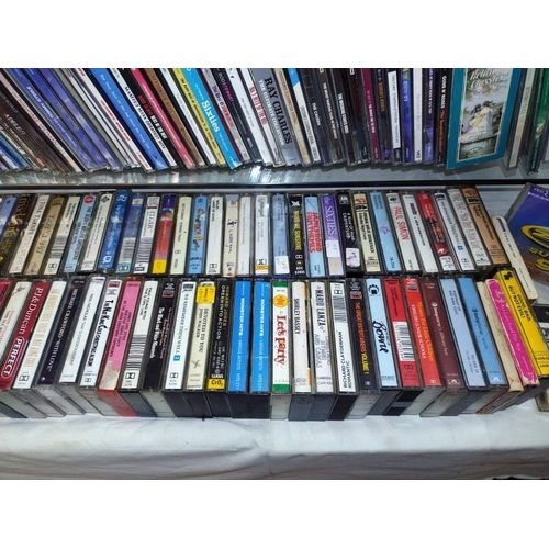 1196 - A large quantity of CD's and a quantity of cassette tapes including Madonna and Eric Clapton etc