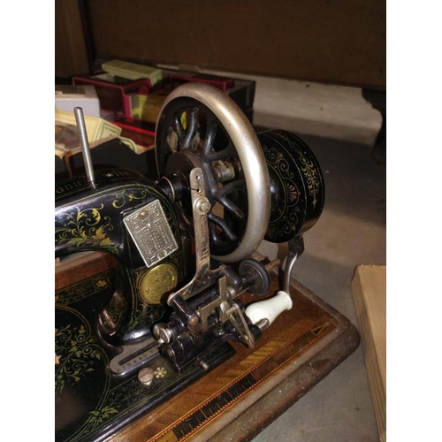 1198 - A vintage Frister Rossmann sewing machine in an inlaid box.