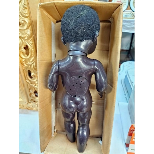 1206 - A vintage pedigree black doll head separated voice box not working. Height 40cm