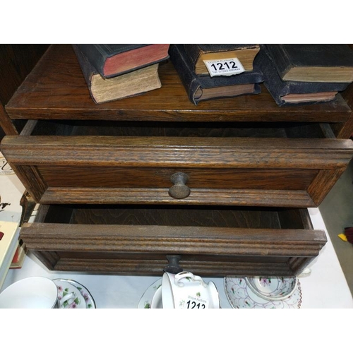 1211 - An oak two drawer unit. 51cm x 31cm x Height 64cm. COLLECT ONLY.