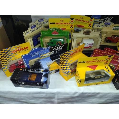 1255 - A mixed lot of boxed Diecast vehicles including Days Gone, Maisto, Classic Cars etc.,