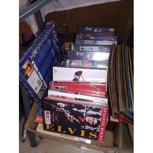 1299 - A quantity of Elvis LP's and VHS tapes. COLLECT ONLY.