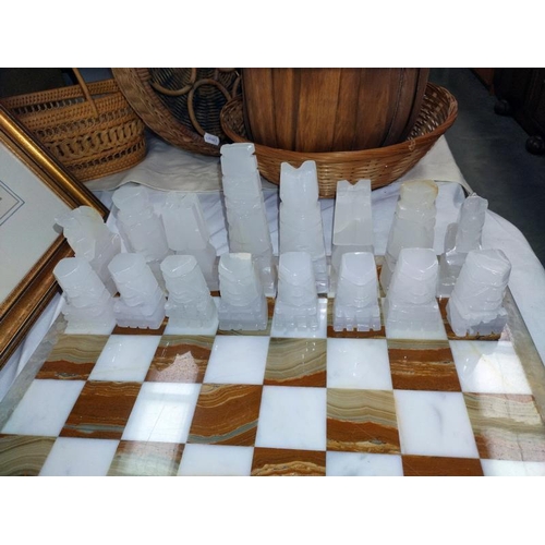 1302 - A polished stone chess set.  COLLECT ONLY.