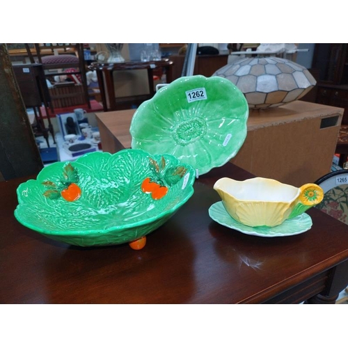 1262 - A Carlton ware leaf dish and sauce jug on a plate and an unmatched plate.