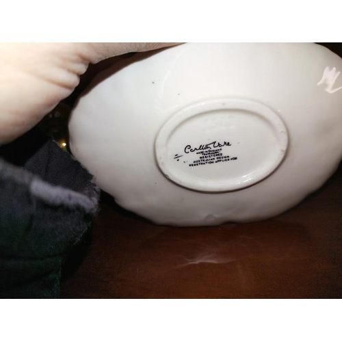 1262 - A Carlton ware leaf dish and sauce jug on a plate and an unmatched plate.