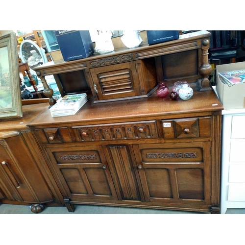 1279 - A 1950's oak buffet cupboard. 124cm x 48cm x 123cm.  COLLECT ONLY.