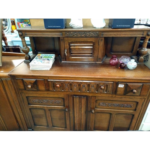 1279 - A 1950's oak buffet cupboard. 124cm x 48cm x 123cm.  COLLECT ONLY.