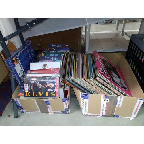 1299 - A quantity of Elvis LP's and VHS tapes. COLLECT ONLY.