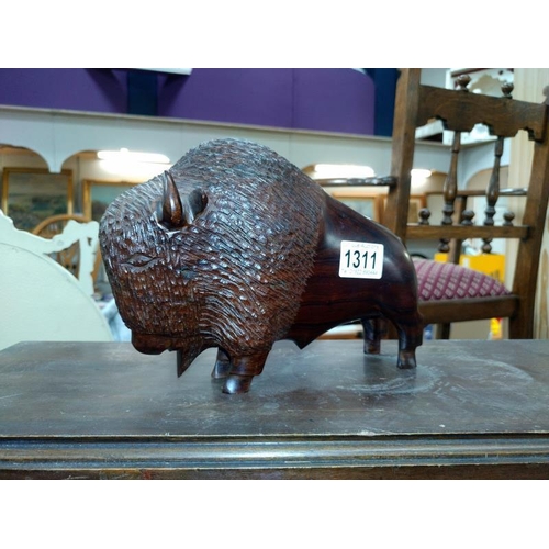 1311 - A carved wooden Bison Length 25cm. COLLECT ONLY.