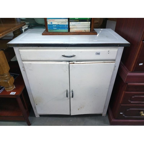 1343 - An enamel top kitchen cupboard. 81cm x 33xm x height 83cm. COLLECT ONLY.