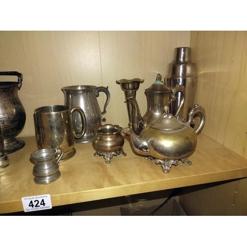 424 - A shelf of silver/ pewter plated items