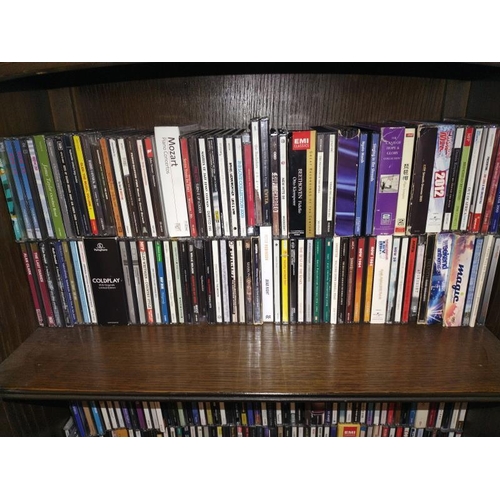 438 - Three shelves of approximately 250 CD's.