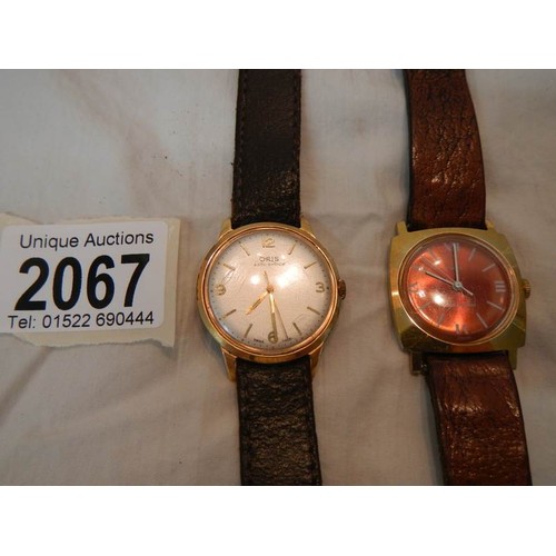 2067 - A gent's Timex wrist watch with leather strap in working order and a Oris gent's wrist watch in work... 