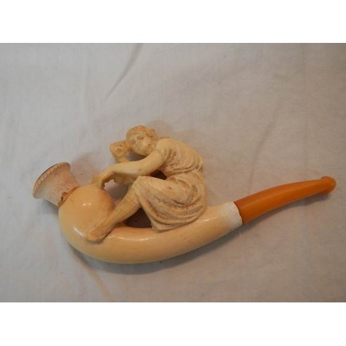 2068 - A cased Victorian pipe as a figure and one other (both have repairs or a/f)