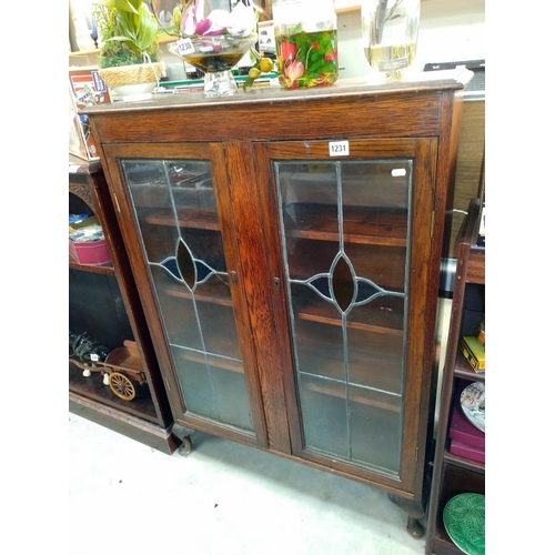 1231 - 1930's display cabinet with locked glass doors. 89cm x 27cm x height 122cm.  COLLECT ONLY.