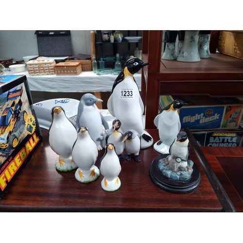 1233 - A collection of Penguin models including Large Poole example and smaller Poole example, etc.