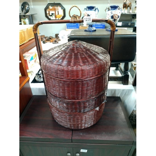 1238 - A large Wicker tiered sewing basket with contents. 40cm x 65cm.