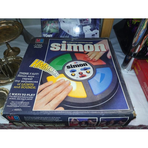 1374 - A 1970/80's electronics Simon and Tomy space turbo electronic games.