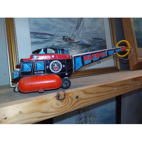 1376 - A Japanese tinplate battery operated helicopter A/F and a Triang Hi-Way trencher