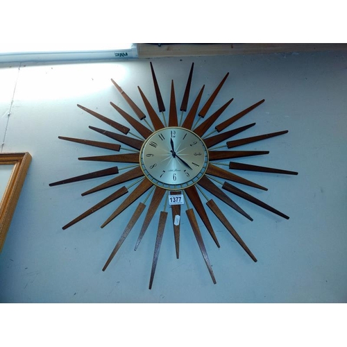 1377 - A retro Sith Thomas Teak sunburst battery wall clock. COLLECT ONLY.