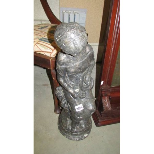 2566 - A concrete garden ornament of a seated girl, 63 cm tall, COLLECT ONLY.