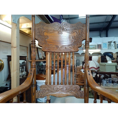 1450 - An ornate oak Carver chair with red leather seat. COLLECT ONLY.