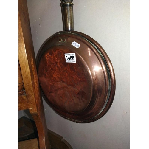 1488 - A Victorian copper warming pan.