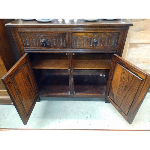 1493 - A 1950's dark oak bow top dresser. 92cm x 43cm x height 86-180cm. COLLECT ONLY.