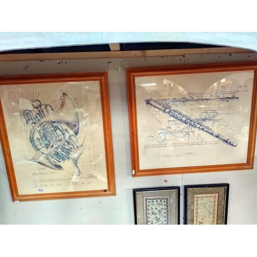 1513 - A pair of framed & glazed prints of musical instruments (68cm x 58cm)