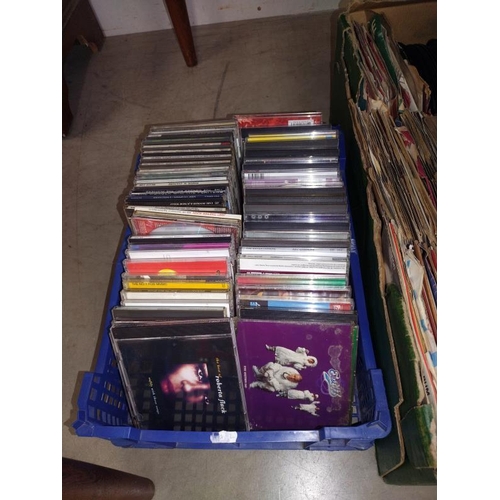 1516 - A collection of LP records, a box of singles & a quantity of CD's