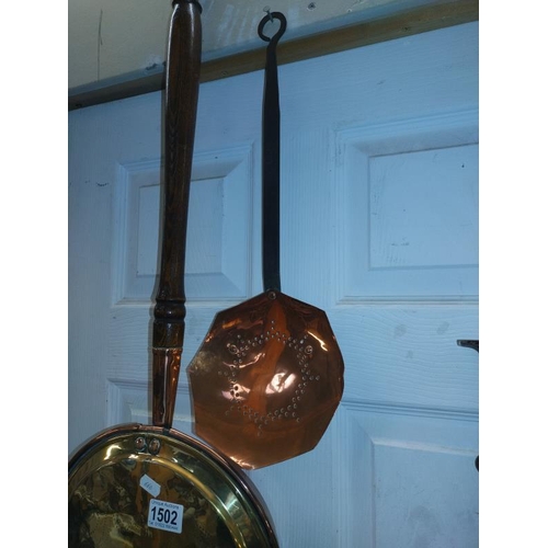 1502 - A Victorian copper and brass bed warming pan & a milk skimmer