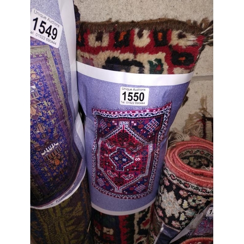 1550 - A small red/blue Persian style rug. Length 140cm x 97cm. COLLECT ONLY.