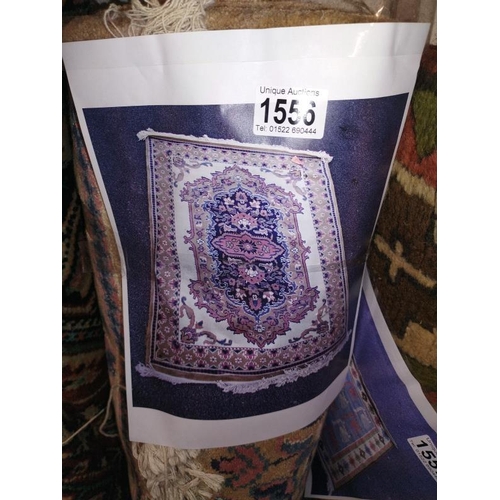 1556 - An oriental style pattern rug in beige/white. Length 190 cm x 122cm. COLLECT ONLY.