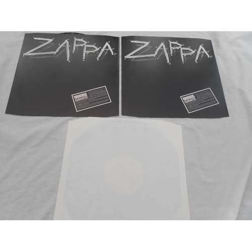 45 - 2 x Frank Zappa records Both in mint condition E 2402341 and EJ 27 0256 Mint