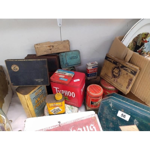 56 - A quantity of interesting old tins etc.