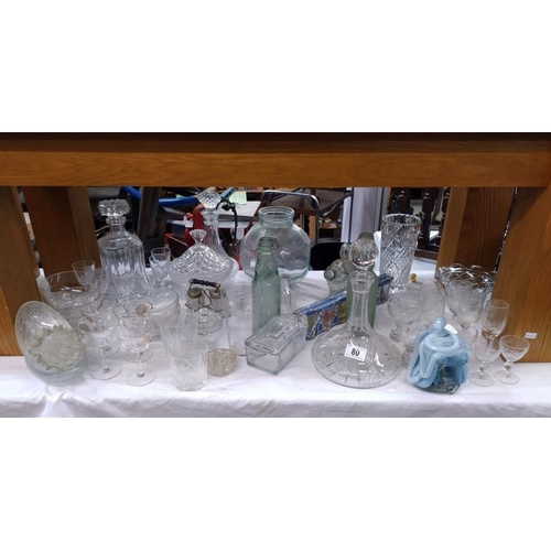 80 - A good lot of glassware including a ships decanter & an unusual goldfish bowl