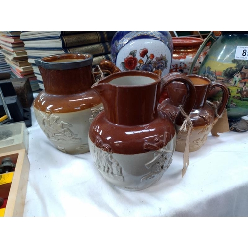 85 - A quantity of stoneware jugs including Doulton A/F