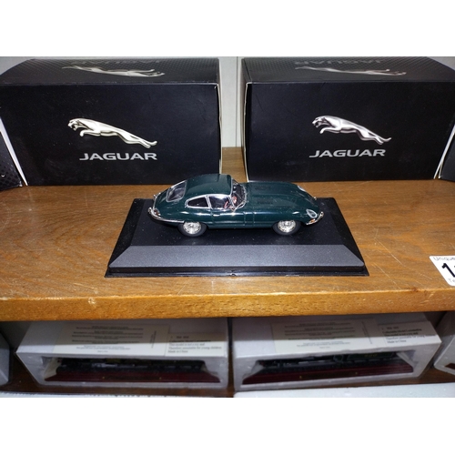 1124 - A box of Atlas editions best of British Jaguar model & DVD